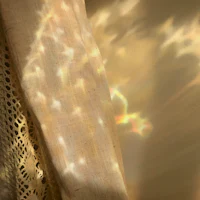 a curtain with a light shining through it