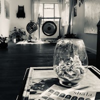 a glass vase on a table in a room